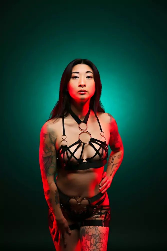 Image of teal background woman in lingerie