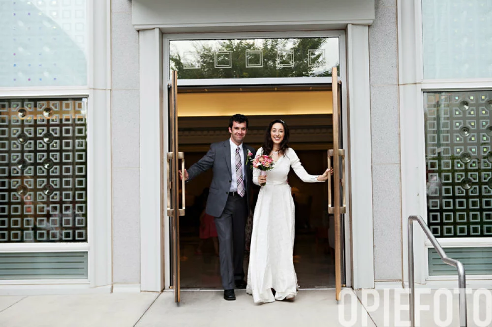 Image of bride and groom exiting temple