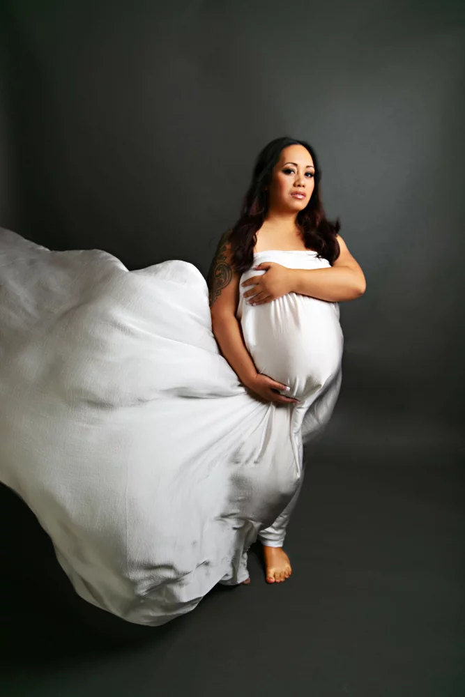 Image of maternity pregnant woman posing for photos