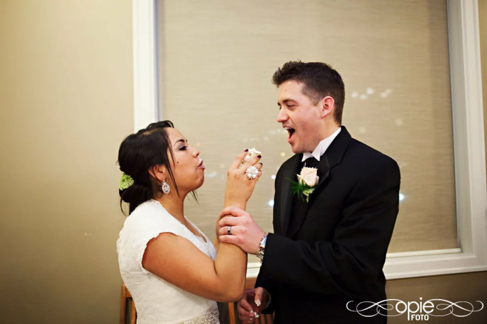 Image of bride and groom cake smashing