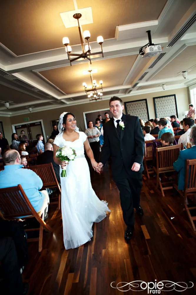 Image of bride and groom walking down the aisle