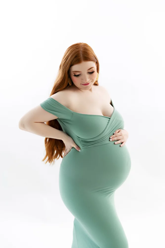 Image of pregnant woman wearing maternity gown